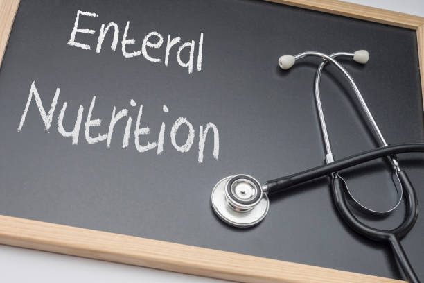 Enteral nutrition written on a blackboard, conceptual image, horizontal composition stock photo
