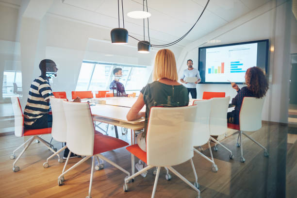 istock Staff asking their manager questions during an office presentation 1131588744
