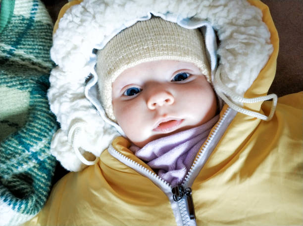 Baby girl sleeping in a sroller in winter 4 month baby girl sleep in the stroller. Healthy lifestyle concept baby stroller winter stock pictures, royalty-free photos & images