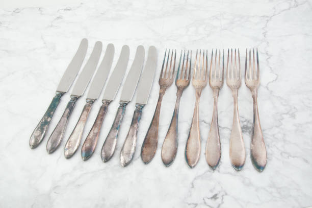istock Vintage knives and forks on white gray background. 1131590196