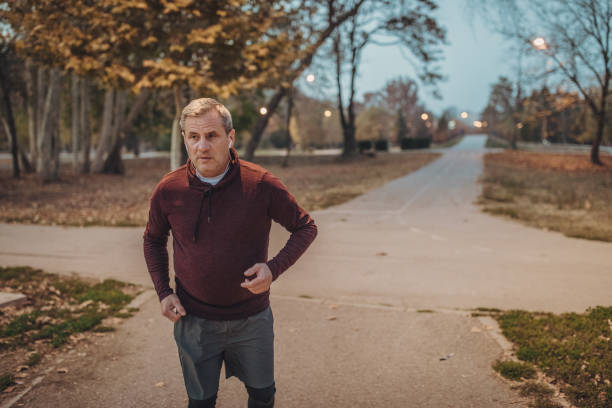 istock Senior runner listening to music 1131591824