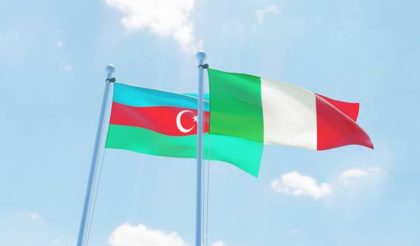 istock Italy and Azerbaijan, two flags waving against blue sky 1131594476