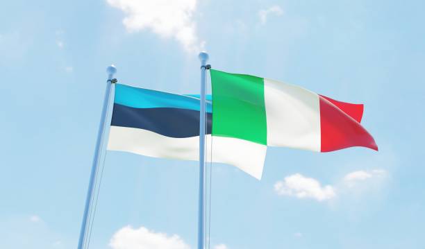 istock Italy and Estonia, two flags waving against blue sky 1131594585