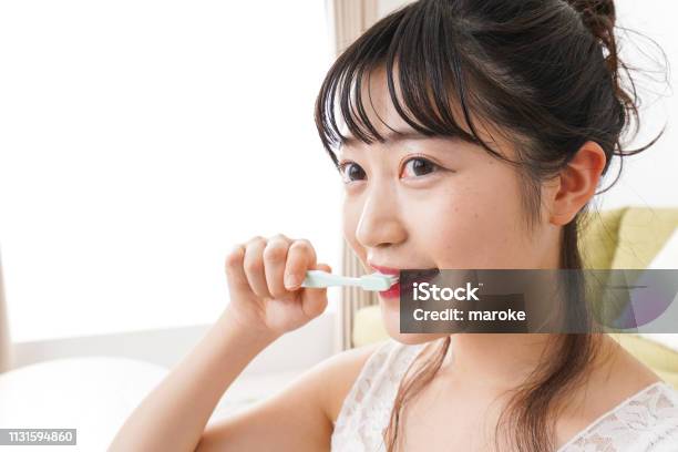 Young Woman Brushing A Tooth Stock Photo - Download Image Now - Adult, Asia, Bad Breath
