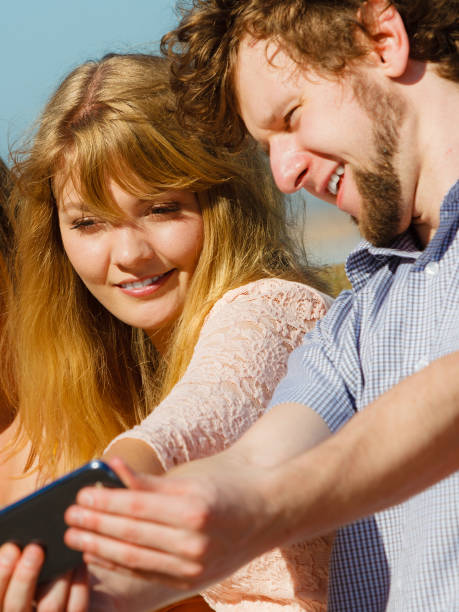 istock Friends taking selfie photo with smartphone. 1131595842