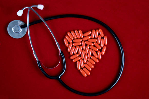 Heart medication, studio shot on a red background.