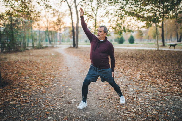 istock Senior runner stretching at the park 1131596770