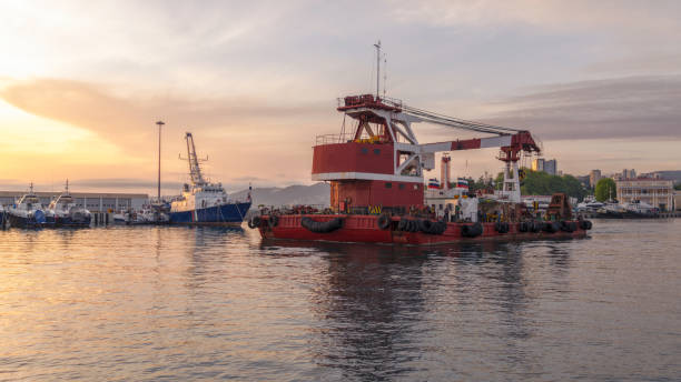istock Large barge with a powerful crane in the port 1131597710