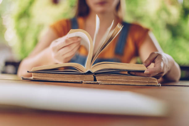 istock Woman reading a book 1131599958