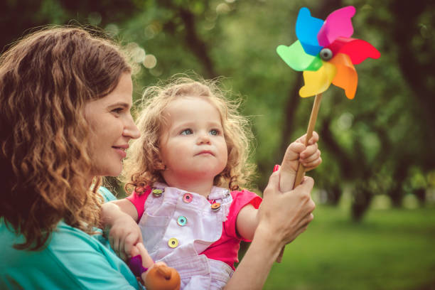 Mother and daughter in summer park
