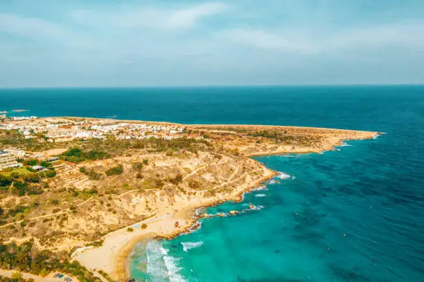 Beautiful Cyprus, Konnos Bay in Cape Greko natural park, rock arch near of Ayia Napa and promenade (molos) Limassol Cyprus and aerial photo of Limassol