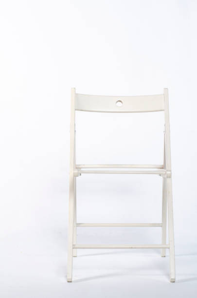 istock miniature chair on wooden floor 1131601148