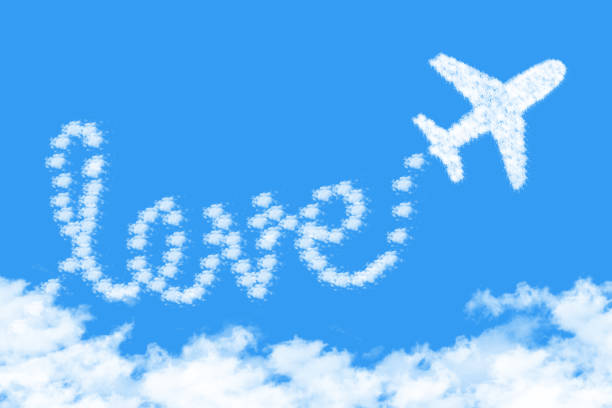 istock Airplane shape clouds love route. Romantic travel concept 1131601438