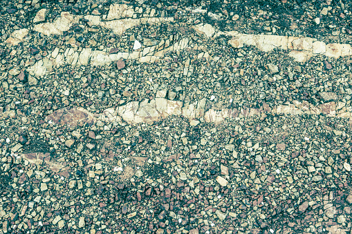 Photograph of texture rocky soil that can be used for mockups, design, art and patterns, background and textures.