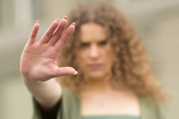 istock Woman showing stop sign with her hand 1131602978