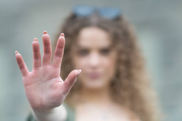 istock Woman showing stop sign with her hand 1131602993