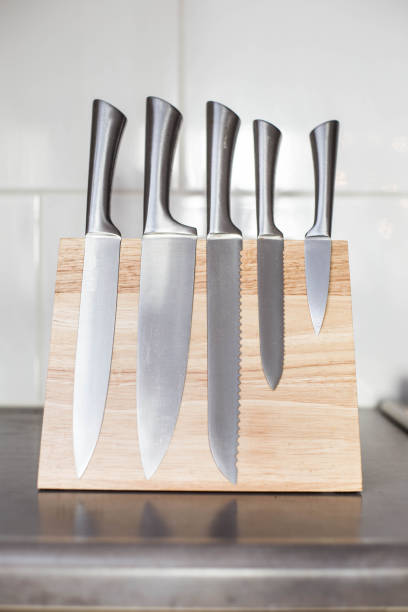 istock knives with magnet wood block on the kitchen counter, modern design 1131604458