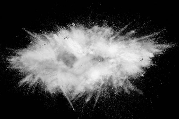 istock Bizarre forms of white powder explosion cloud against black background.White dust particles splash. 1131605900
