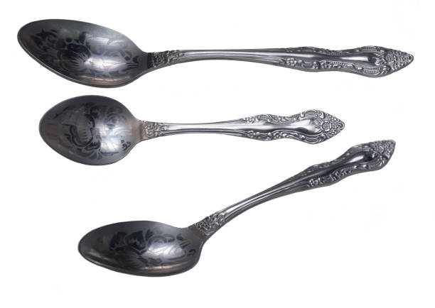 istock small engrave tea stainless spoon isolated  closeup 1131607161