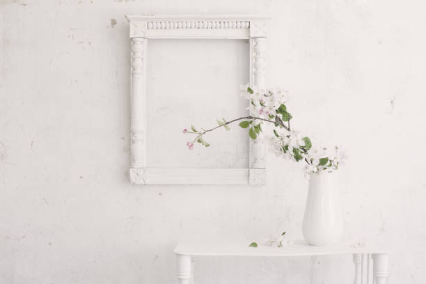 istock beautiful spring flowers on background white wall 1131607540