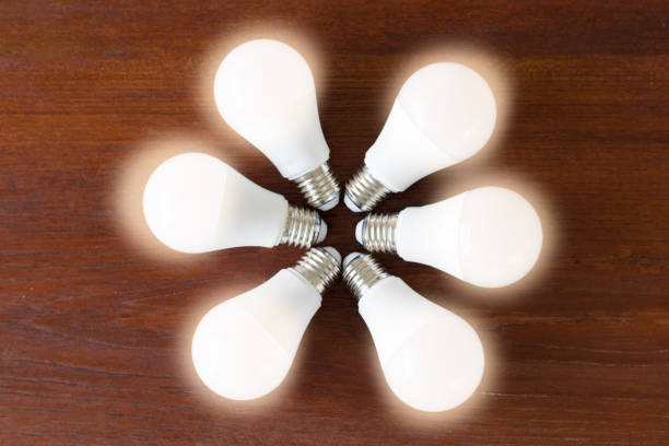 istock Power saving CSR concept.New LED bulb with light on line as flower or asterisk. 1131609160