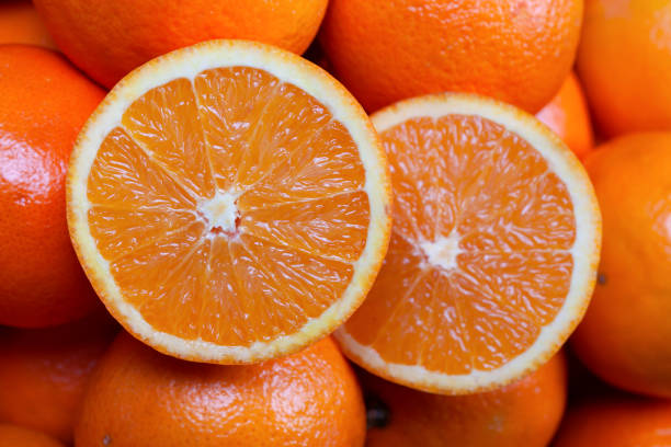 istock A pile of oranges with a cut in half on top 1131610278