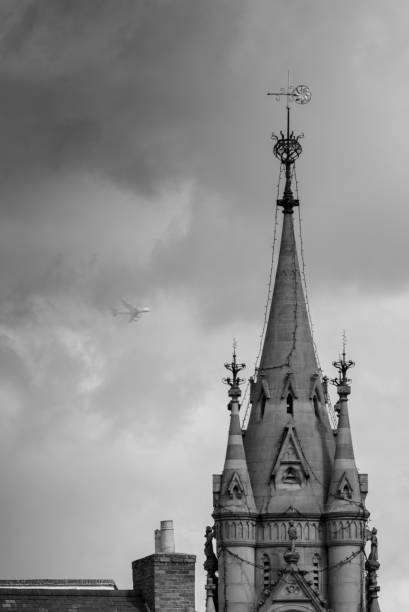 istock black and white tower with storm and airplane in background 1131610324