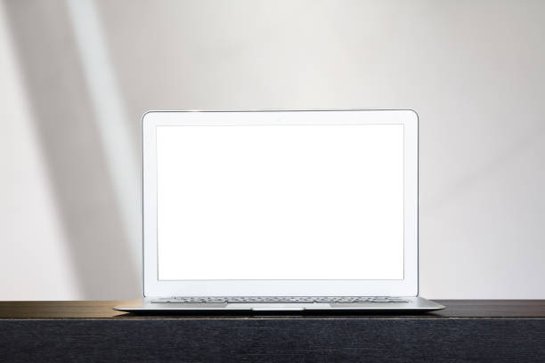 istock Mock up of modern computer or laptop with over blur festive bokeh background. 1131610581