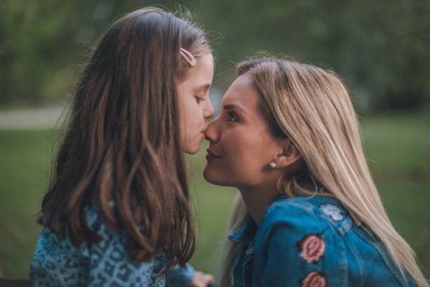 istock Mother and daughter eskimo kissing 1131615006