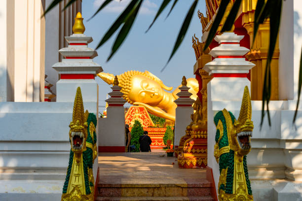 istock Stunning view of the reclining buddha statue in Pha That Luang complex. 1131615090
