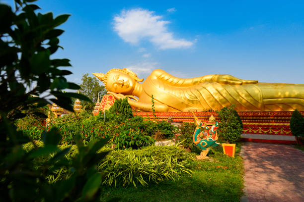 istock Stunning view of the reclining buddha statue in Pha That Luang complex. 1131615145