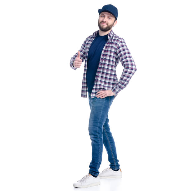 istock Man in jeans, shirt and cap standing smiling super good 1131617362