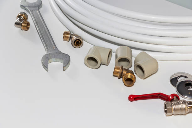 istock plumbing tools and equipment on white with copy space 1131617611