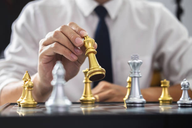 istock Planning and Strategic concept, Businessman playing chess and thinking strategy about crash overthrow the opposite team and development analysis for win and successful 1131619347