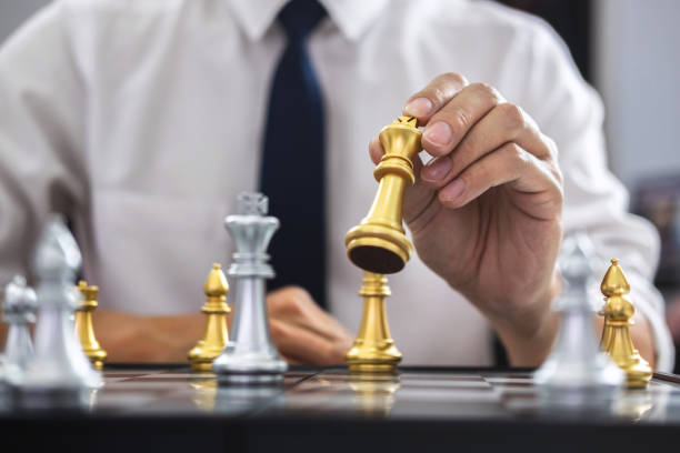 istock Planning and Strategic concept, Businessman playing chess and thinking strategy about crash overthrow the opposite team and development analysis for win and successful 1131619353