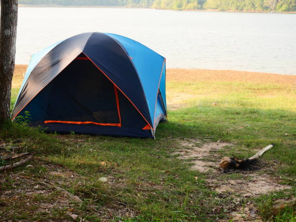 istock Camping tent in a camping in a forest by the river 1131619708