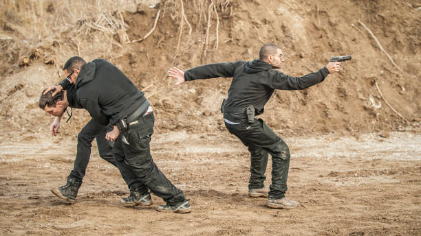 istock Bodyguard and VIP people security protection. Combat gun shooting training 1131620474