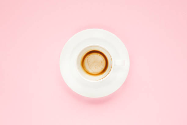 istock The empty cup of coffee on pink background 1131621030