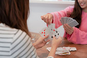 Japanese girls enjoy playing cards with each other