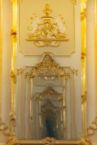 istock Tunnel of reflections in old golden mirror. Old interior. 1131622004