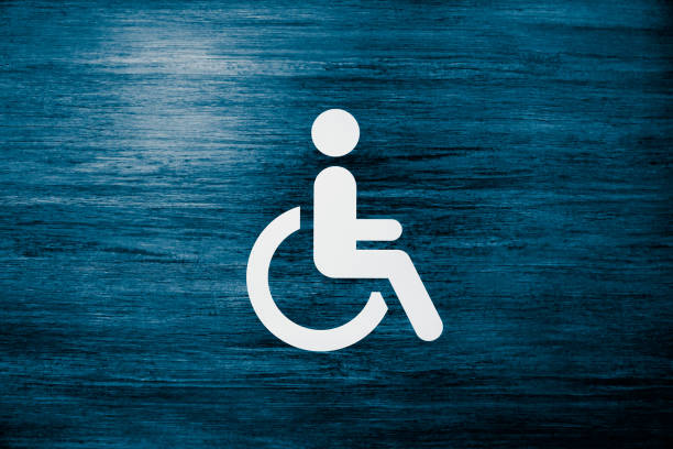 Disabled Person Sign, Wheelchair Symbol International Symbol of Access on a Blue Surface wheelchair lift stock pictures, royalty-free photos & images