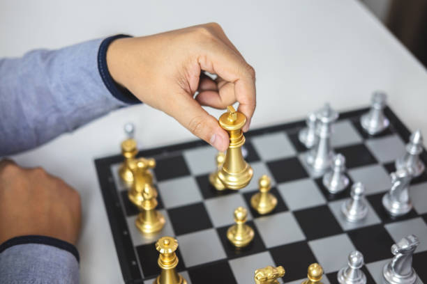 istock Planning and Strategic concept, Businessman playing chess and thinking strategy about crash overthrow the opposite team and development analysis for win and successful 1131628659