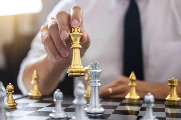 istock Planning and Strategic concept, Businessman playing chess and thinking strategy about crash overthrow the opposite team and development analysis for win and successful 1131628663