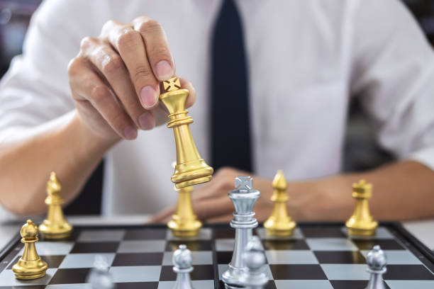 istock Planning and Strategic concept, Businessman playing chess and thinking strategy about crash overthrow the opposite team and development analysis for win and successful 1131628673