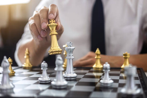 istock Planning and Strategic concept, Businessman playing chess and thinking strategy about crash overthrow the opposite team and development analysis for win and successful 1131628676