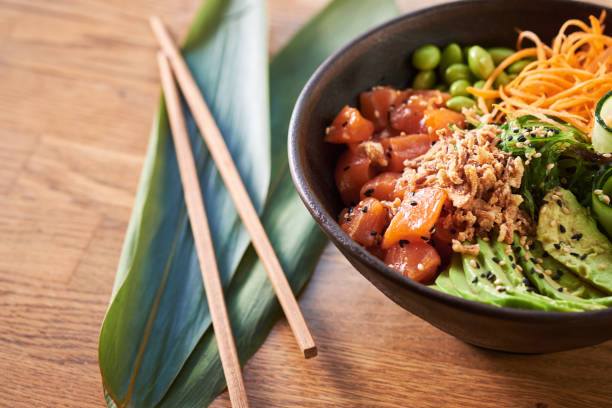istock Poke bowl on wooden background 1131630308