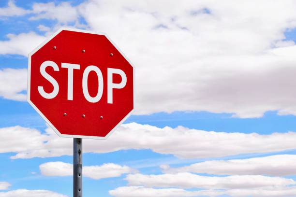 istock Traffic sign STOP isolated, blue sky with clouds on the background 1131630766