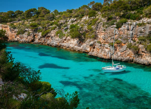 istock small yacht floating in clear azure sea 1131631943