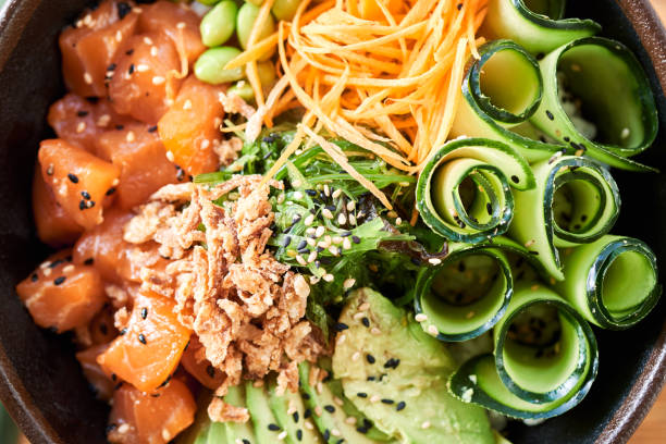 istock Poke bowl on wooden background 1131632076
