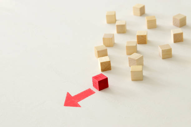 istock One different red cube block among wooden blocks. Individuality, leadership and uniqueness concept 1131637729
